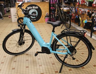 a blue bicycle that is parked in a store