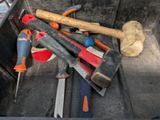 many tools in the back of a truck that is full of them