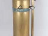 an old brass fire extinguisor on a white background