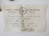 an old document with a stamp on it sitting on a table