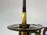 a close up of a sword on a stand on a white background
