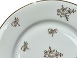 a close up of a plate with flowers on it