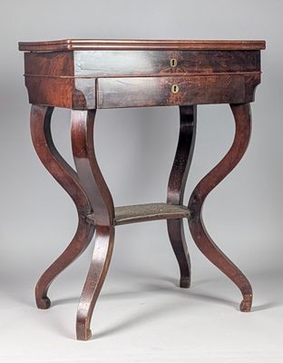 an image of a small table with a drawer on it