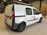 a white van that is parked in a garage