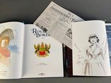 a book open on a table with a drawing of a woman in a dress
