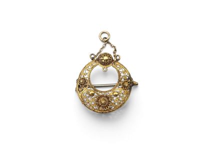 a gold and diamond broochle pendant