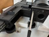 a clamp that is sitting in a box on a table