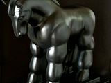 a statue of a horse that is standing on a stand