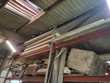 a large pile of wood sitting on top of a metal rack