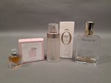 a bottle of perfume next to a box of perfume