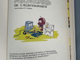 an open book with a picture of a man working on an electrical device