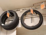 two tires hanging from the ceiling of a store