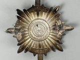 an image of a silver plate with a sunflower design on it