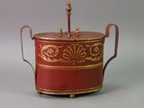 a red and gold box with a handle on it