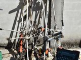 a pile of skis and ski poles on the ground