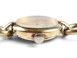 an image of a close up of a watch on a chain