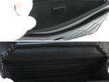 a black purse with a chain hanging out of it