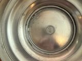 a close up of a metal bowl on a table