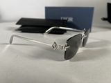 sunglasses on a white table with a black case and a blue box