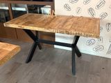 a wooden table with a wooden top and black metal legs