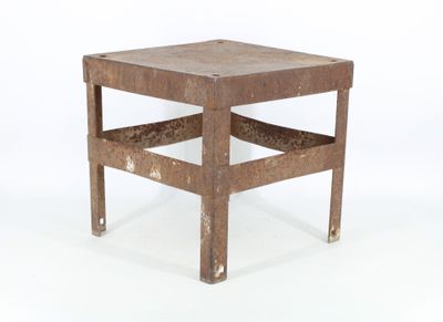 a small wooden table with a metal frame on it