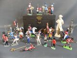 a lot of figurines that are sitting on a table