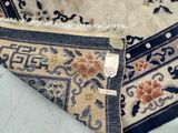 a close up of a rug with a tag on it