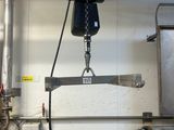 a picture of a machine that is working on a piece of metal