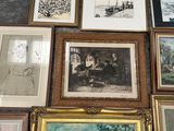 many framed pictures on the wall of this room