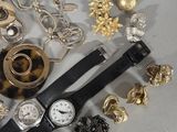 many different types of jewelry on a white surface