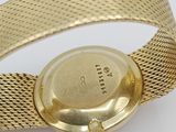 an image of a close up of a wrist watch on a white surface