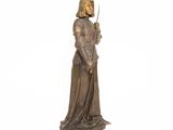 an image of a statue of a woman holding a sword