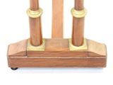 a wooden stand with two candles on top of it