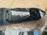 a pair of black shoes that are on a box