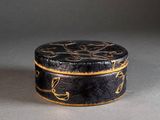 a black and gold box sitting on top of a table