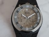 a close up of a wrist watch on a marble surface