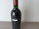 a bottle of wine that is sitting on a table