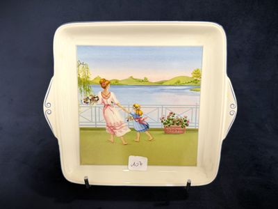a plate with a picture of a woman and a child on it