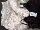 two pairs of women ' s underwear are on a cardboard box