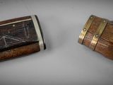two pieces of wood that are sitting on a table