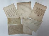 a bunch of old letters and papers sitting on top of a table