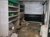 a white van that is parked inside of a building