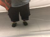 a reflection of a person in a mirror holding an umbrella