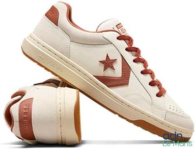 a close up of a pair of shoes with a star on them