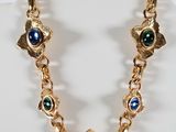 a close up of a necklace on a mannequin display