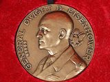 an image of a medal with a man ' s face on it