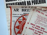 many pamphlets on a table with a red star on it