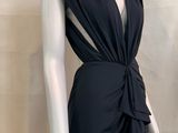 the back of a black dress on a mannequin mannequin mannequin mannequin mannequin mannequin mannequin mannequin