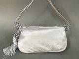 an image of a white purse with a tassel