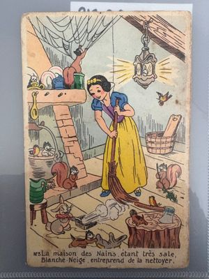 disney ' s snow white and the seven dwarfs book, with a picture of a woman in a yellow dress